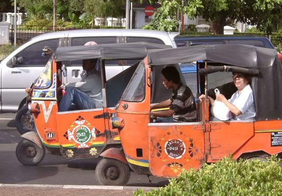 Bajai waiting at traffic light