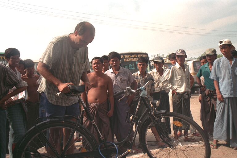 Lots of onlookers at the Mandalay expressbus station, Burma